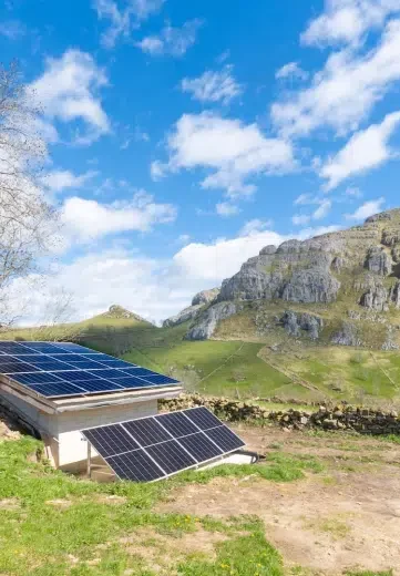 Snow-dusted solar panels in a Canadian winter landscape